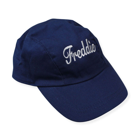 Navy blue cap with 'Freddie' embroidered on a white background