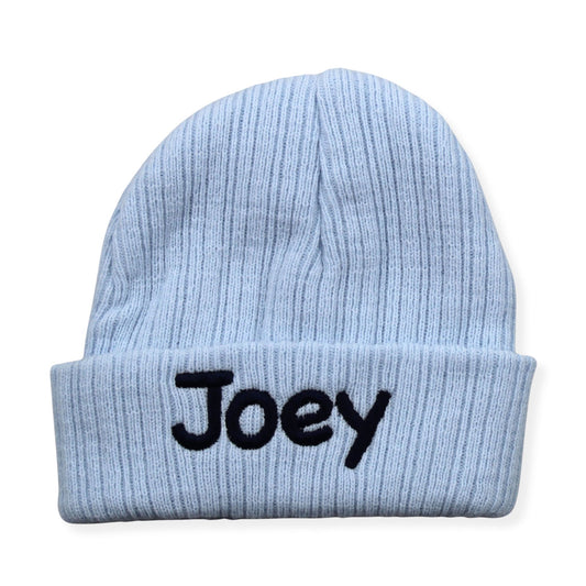 Light blue beanie with 'Joey' embroidered on a white background