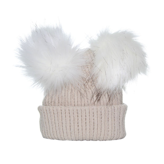 Beige knit beanie with two large white fur pom-poms on a white background