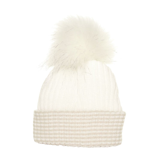 White pom hat with beige waffle trim on a white background