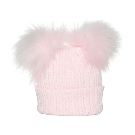 Pink knit beanie with a large fur pom-pom on a white background