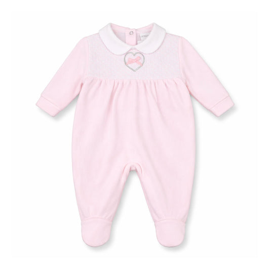 Pink baby onesie with a heart design on a white background