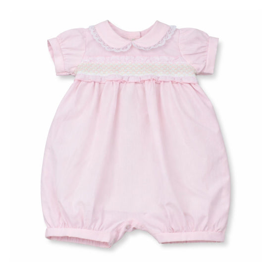 Pink baby romper with lace details on a white background