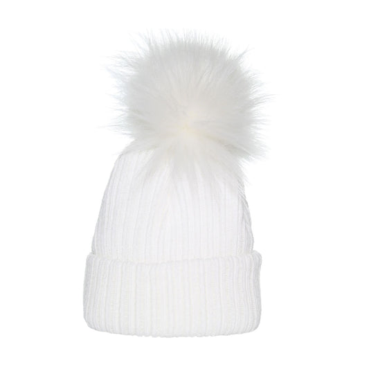 White knit beanie with a large faux fur pom-pom on a white background