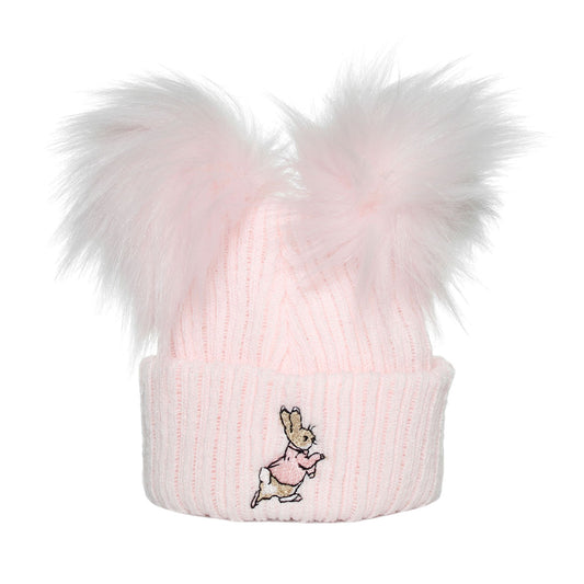 Pink knit beanie with fluffy pom-pom and embroidered design on a white background