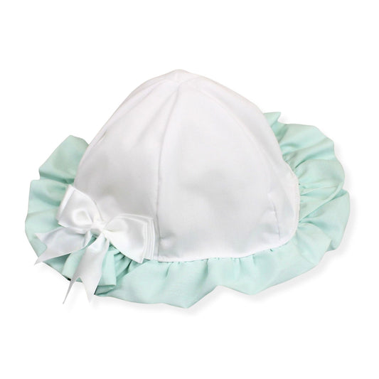 White bonnet with light blue ruffled edge and white bow on a white background