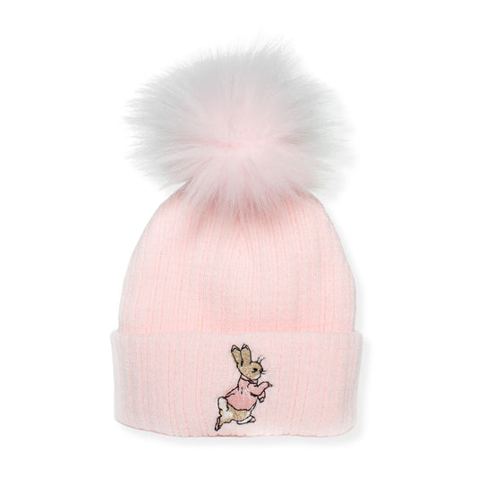 Pink beanie with a fluffy pom-pom and embroidered design on a white background