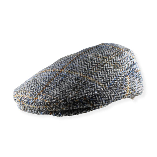 Tweed flat cap on a white background
