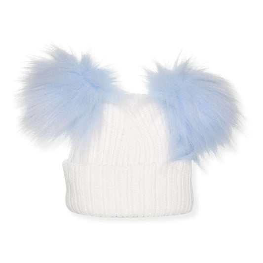 White knit beanie with two large light blue faux fur pom-poms on a white background