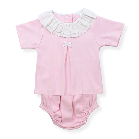 Pink baby outfit with white ruffled collar on a white background