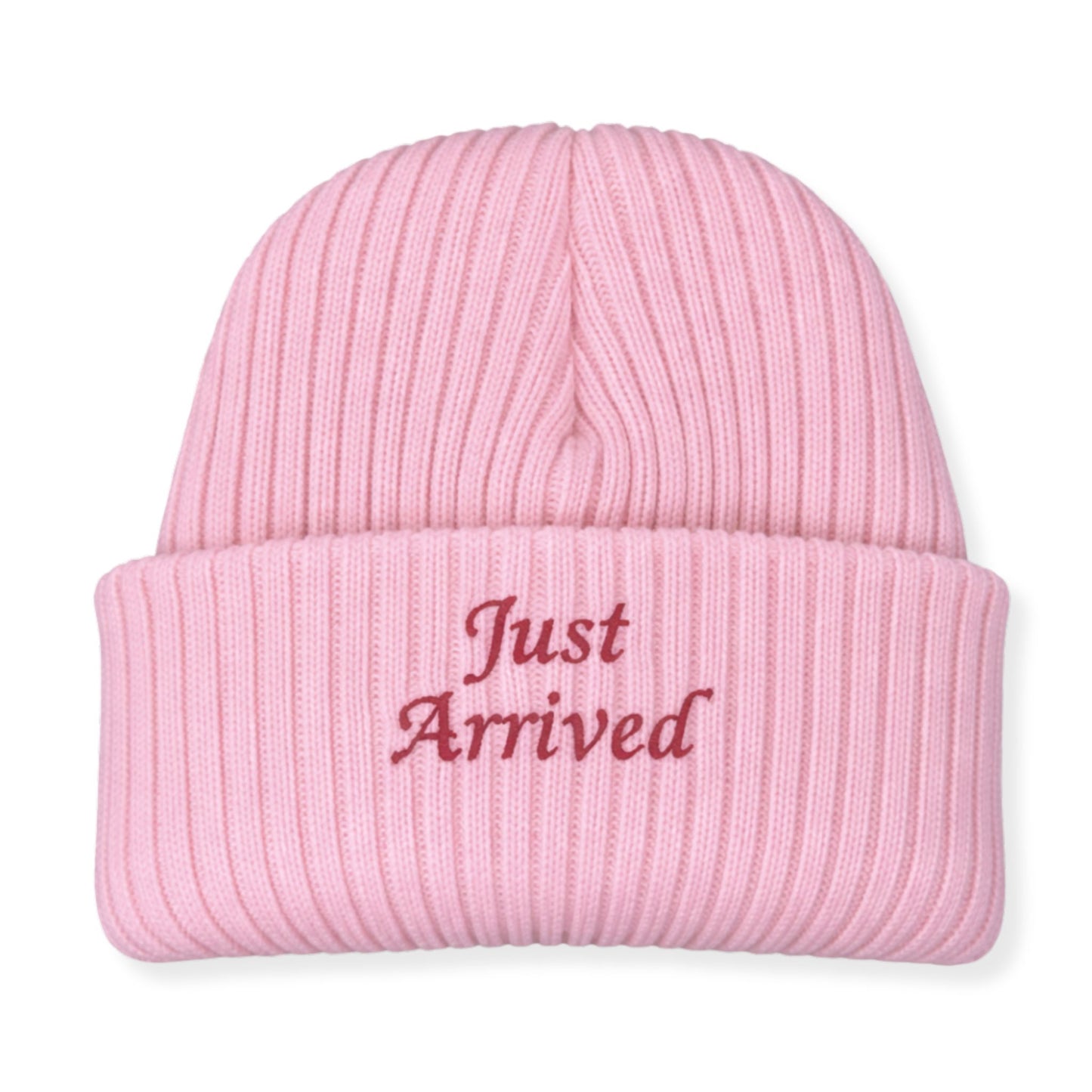 Pink beanie with 'Just Arrived' text on a white background