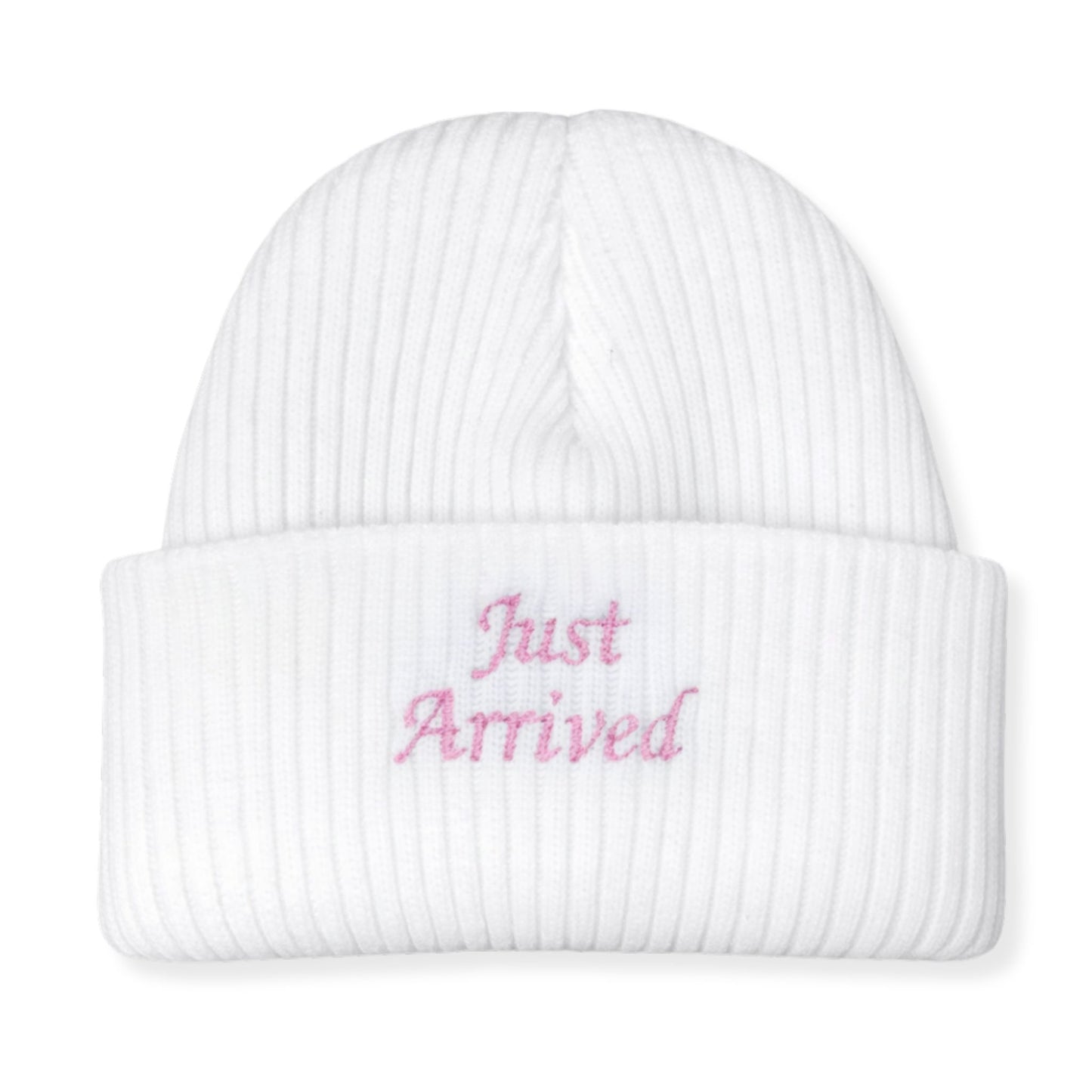 White beanie with 'Just Arrived' text in pink on a white background