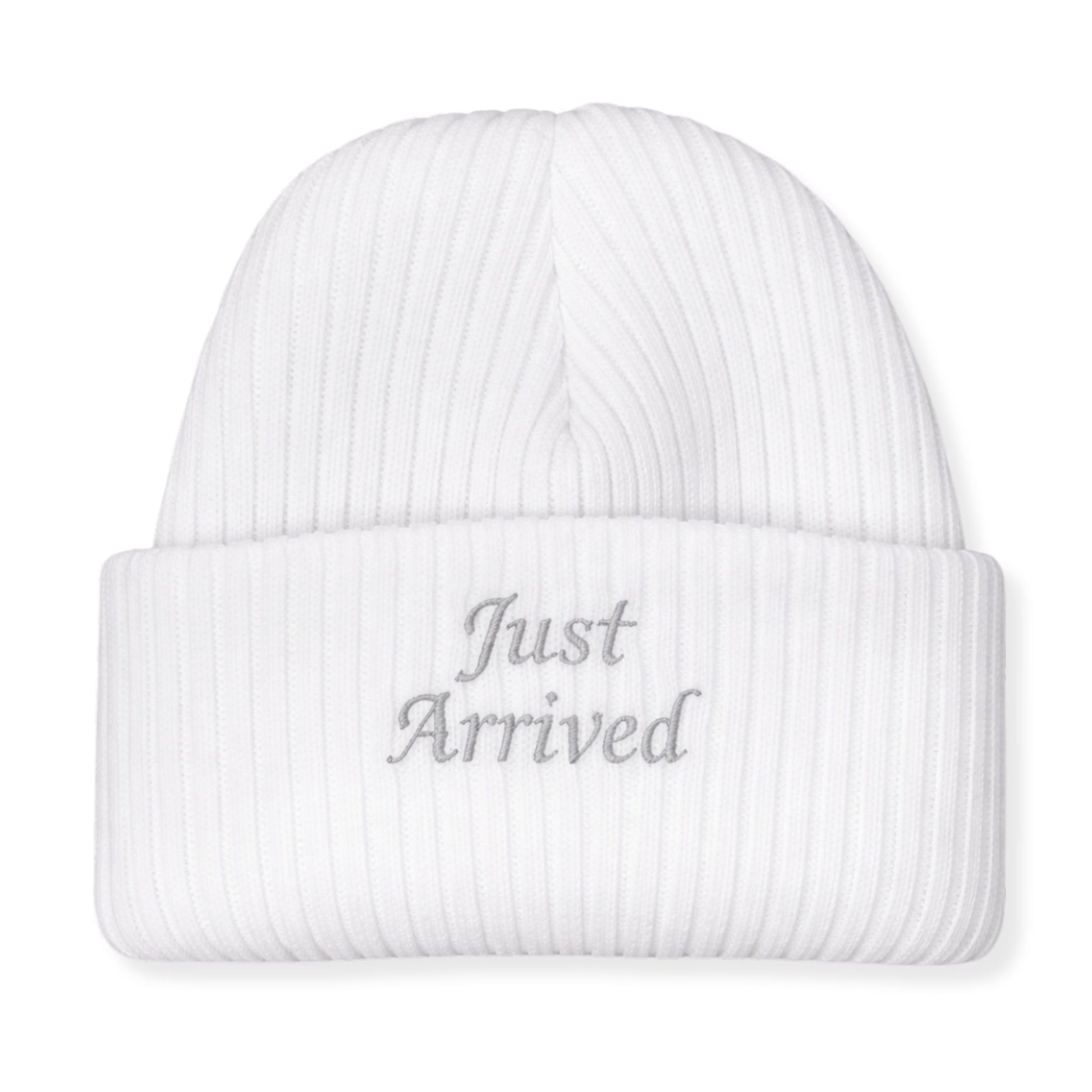 White beanie with 'Just Arrived' text on a white background