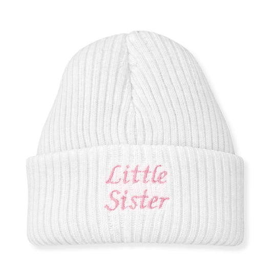 White beanie with 'Little Sister' embroidered in pink on a white background