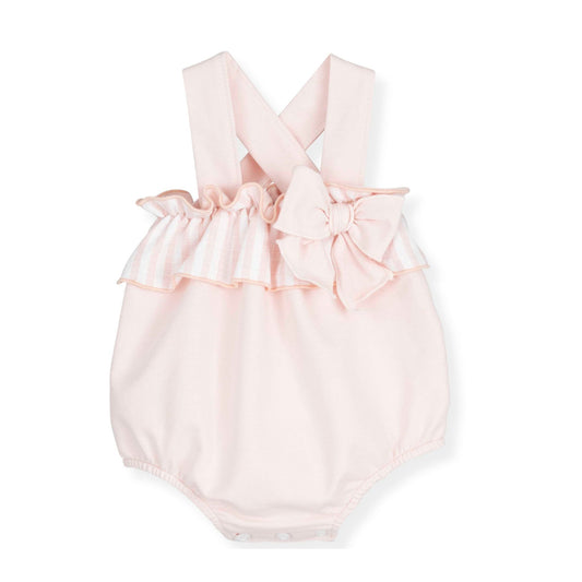 Pink baby romper with bow details on a white background