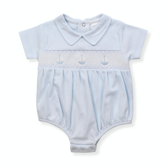 Light blue baby romper with smocked design on a white background