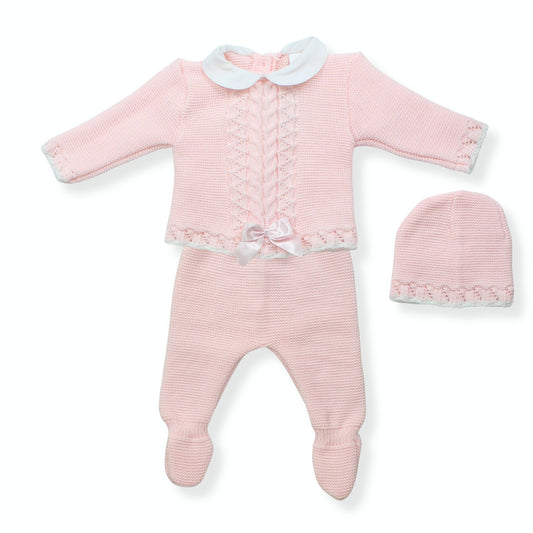 Pink baby outfit with top, pants, and hat on a white background
