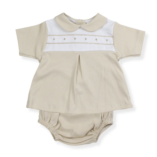 Beige baby outfit with white collar and matching bloomers on a white background