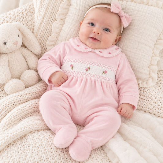 Baby girls pink velour sleepsuit with smocked white chest panel, embroidered pink roses and floral Peter Pan collar
