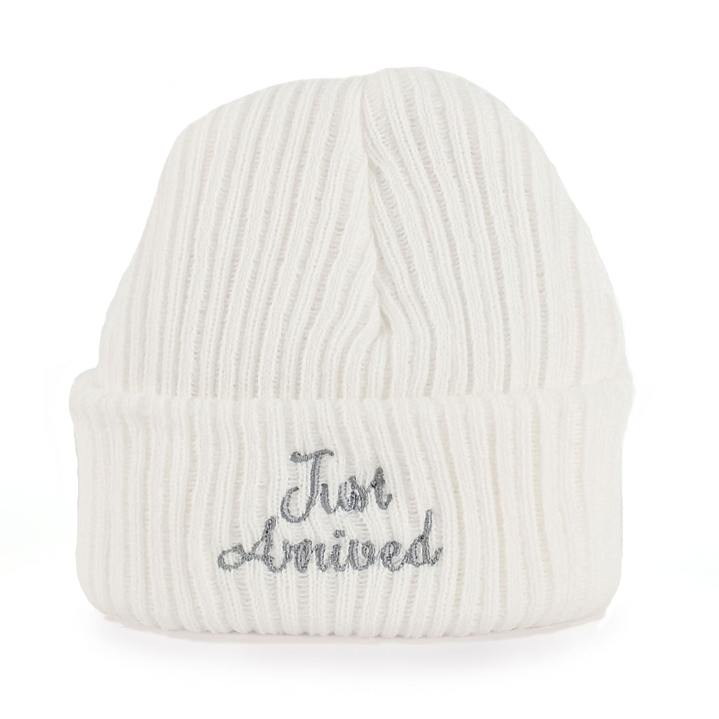 White knit baby beanie with 'Just Arrived' embroidery on a white background