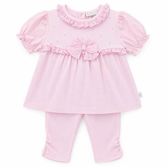 Pink baby outfit with top and leggings on a white background