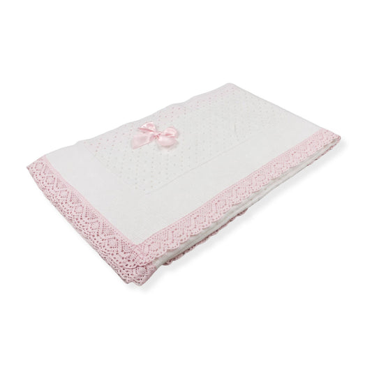 White blanket with pink trim on a white background