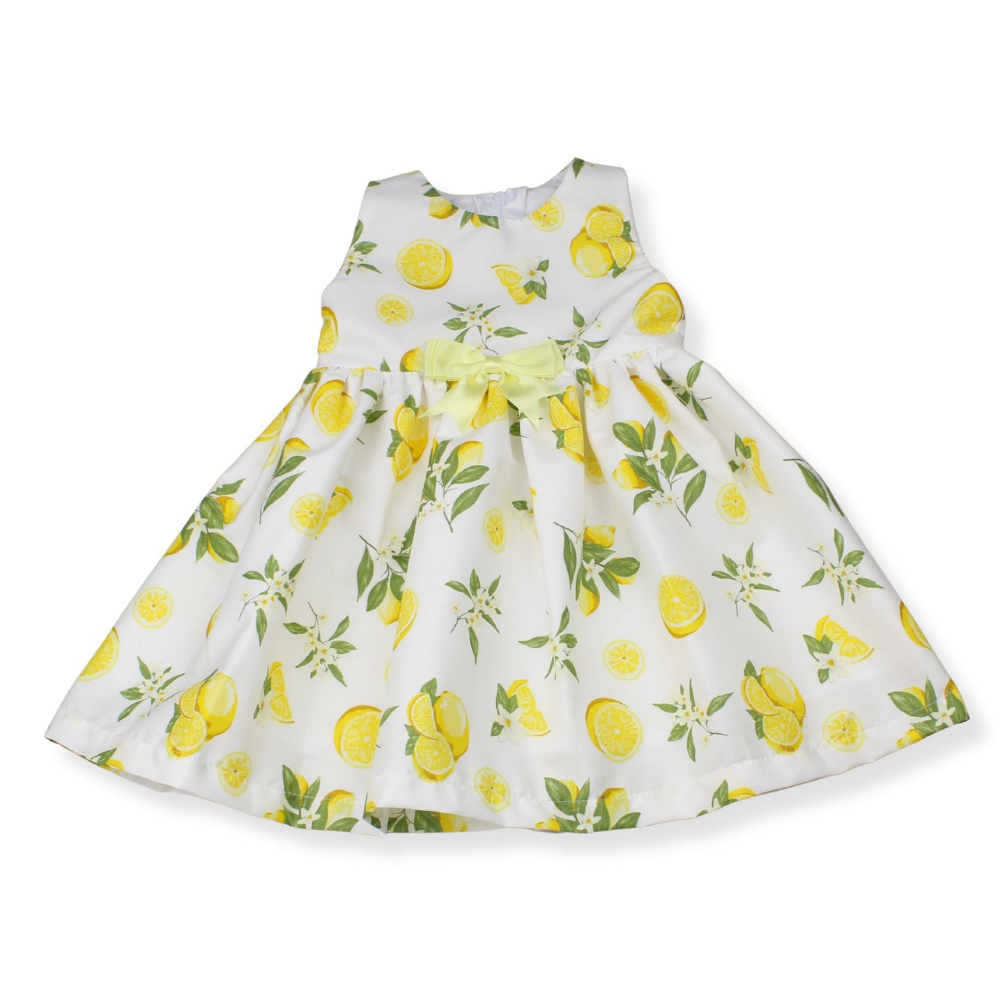 White dress with yellow lemon print on a white background