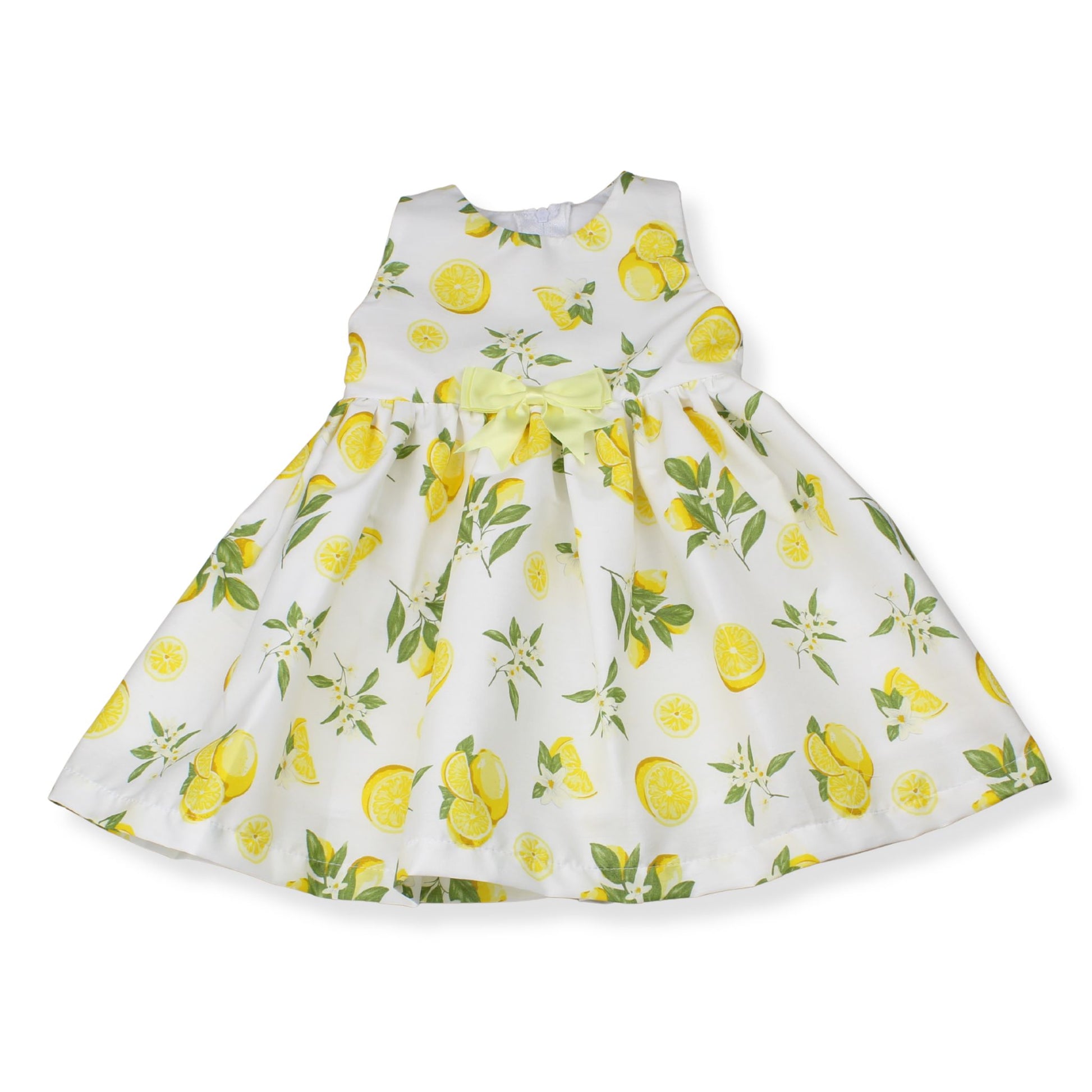 White dress with yellow lemon print on a white background