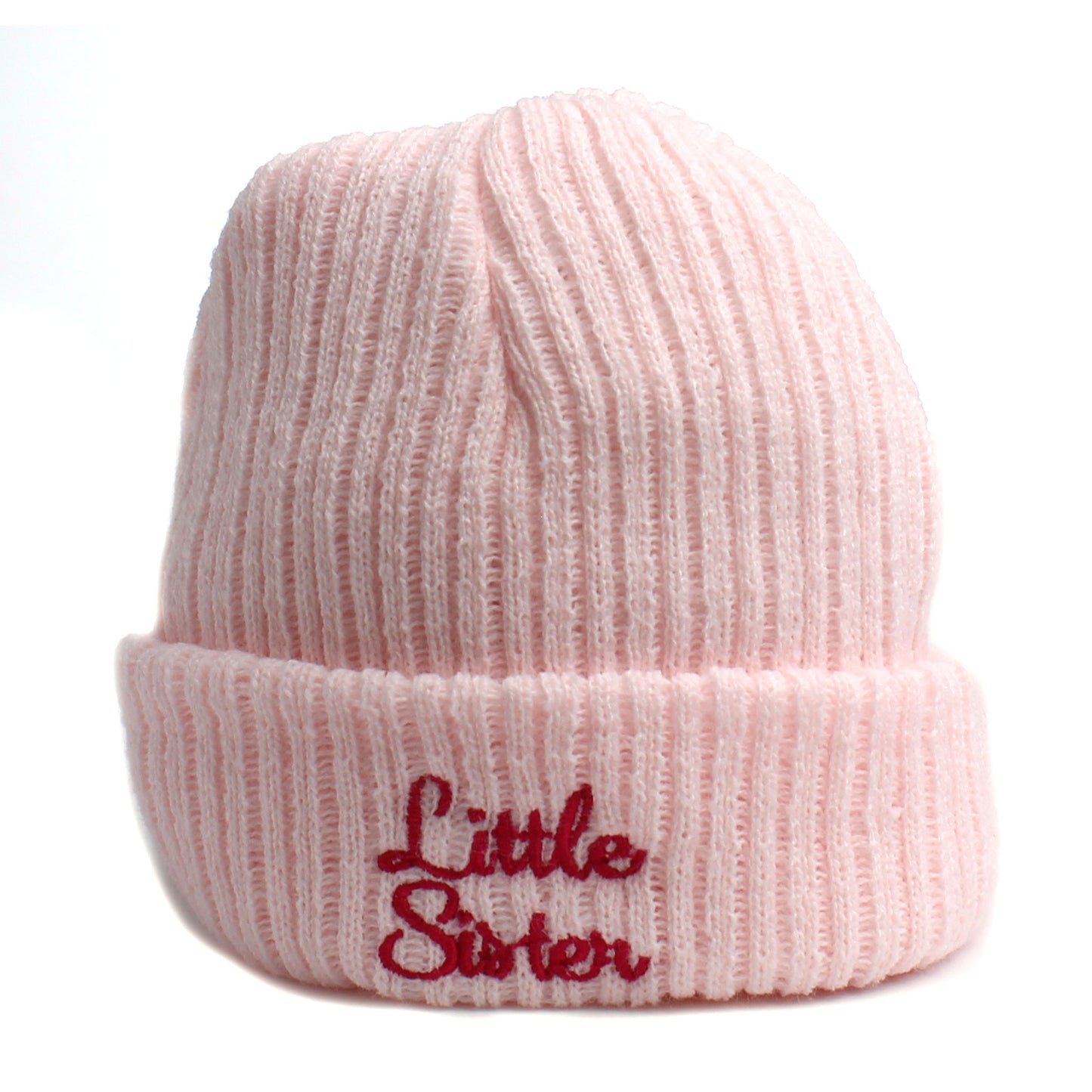 Pink knit beanie with 'Little Sister' embroidery on a white background