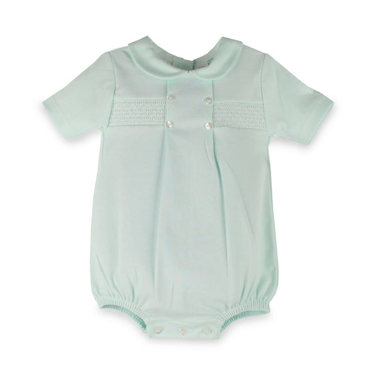 A baby short-sleeve smocked bodysuit in pale mint green, featuring a Peter Pan collar, decorative smocked chest panel with snap buttons, and snap closures at the crotch.