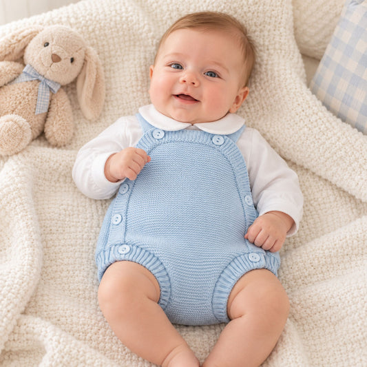 Little Nosh baby boys blue knitted romper with decorative buttons and coordinating white long-sleeved Peter Pan collar top
