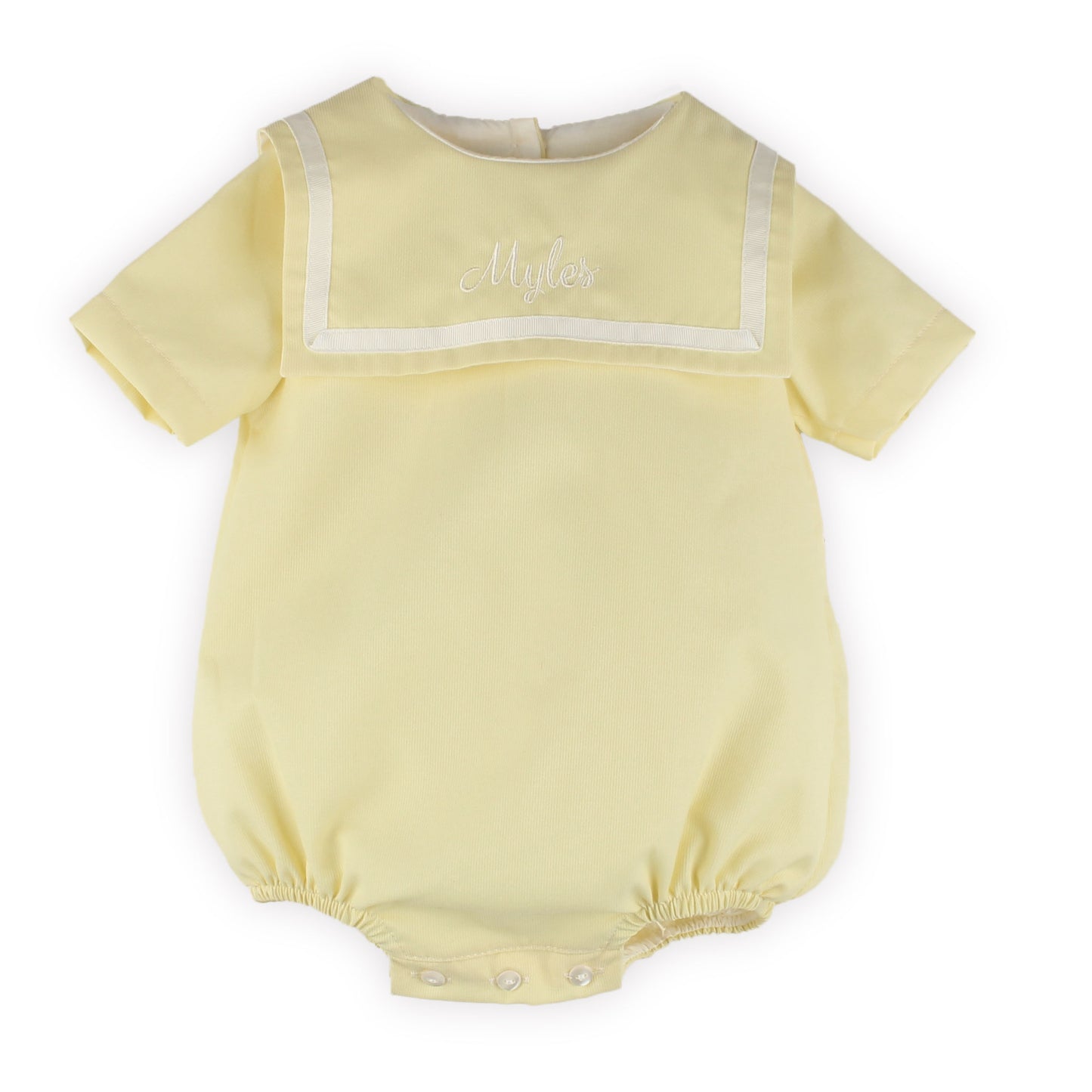 Personalised ellow baby romper with white trim on a white background
