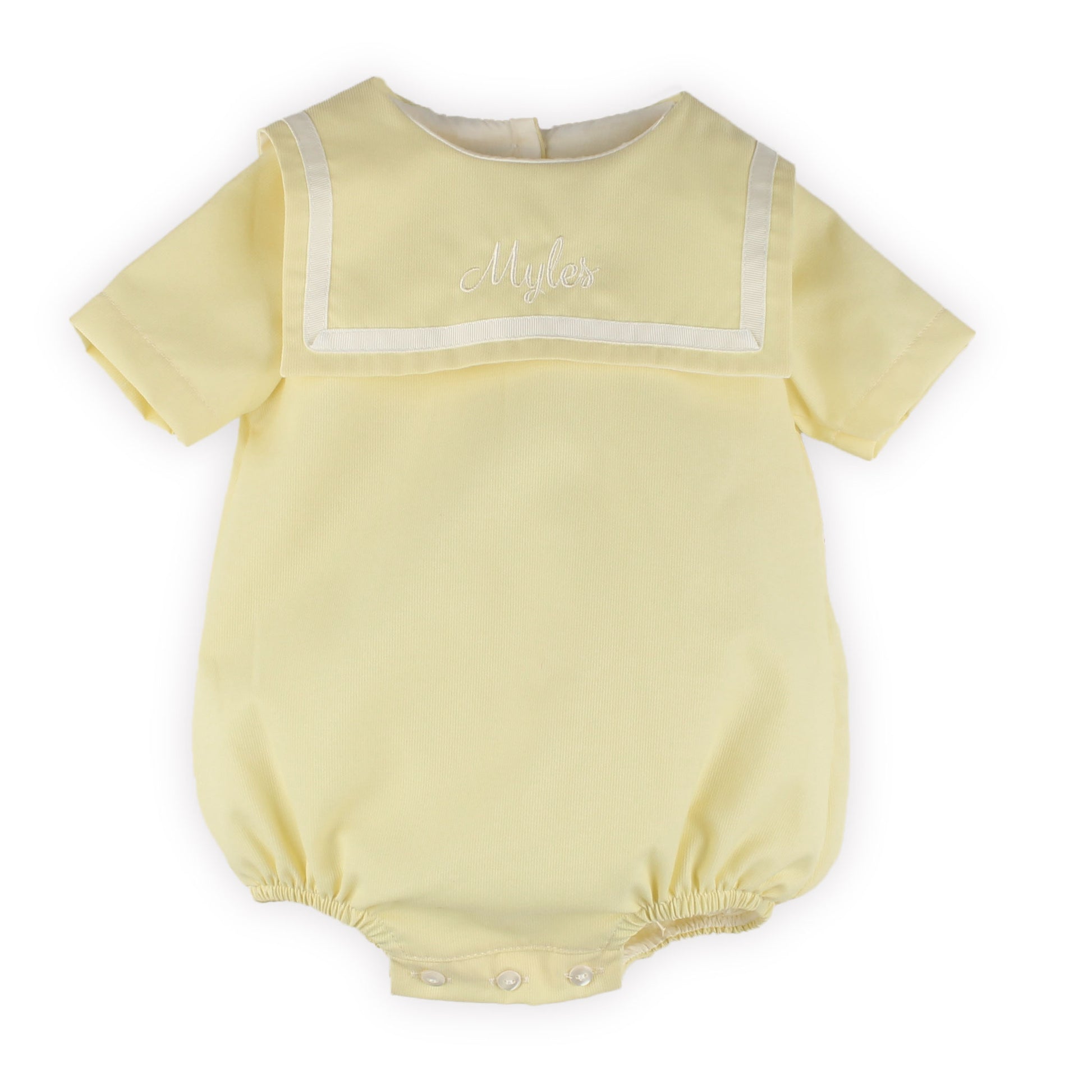 Personalised ellow baby romper with white trim on a white background