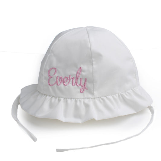 White sun hat with 'Everly' embroidered on it against a white background