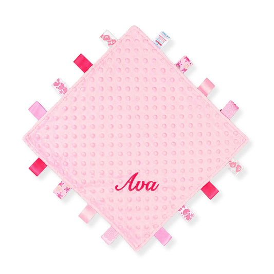 Personalised pink taggy baby comforter with textured fabric and ribbon taggies