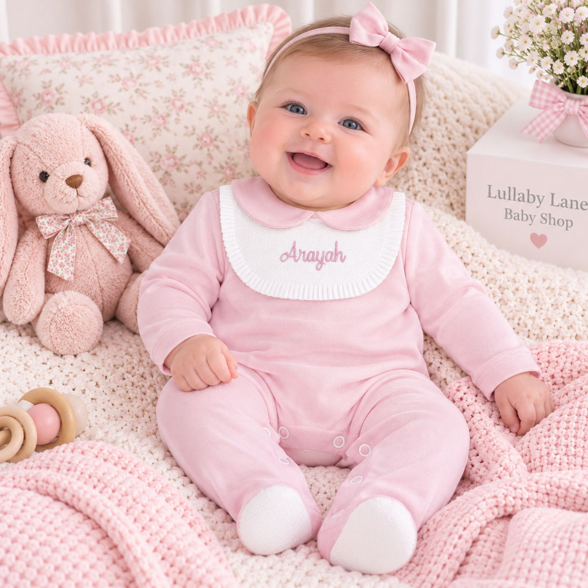 personalised baby grl pink sleepsuit