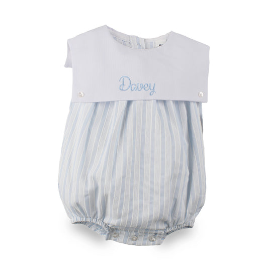 Personalised baby boys blue and white striped bubble romper embroidered with the name Davey on the white front panel.