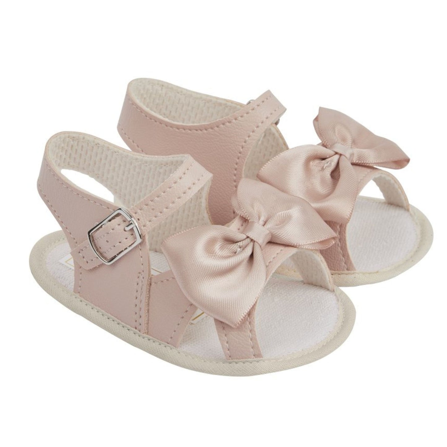 Pink baby sandals with bow details on a white background