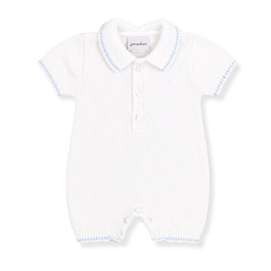 White knitted baby romper with blue trim on a white background