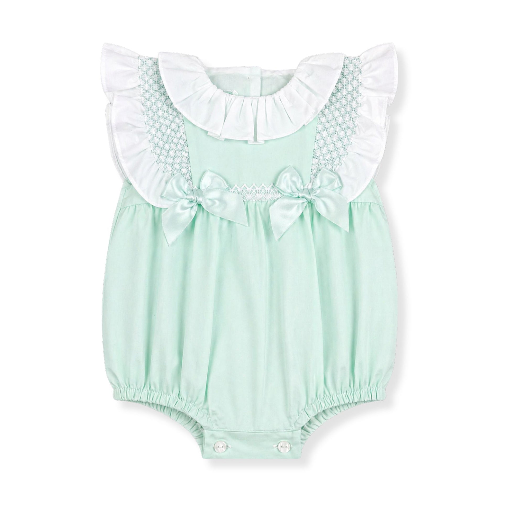 Mint green baby romper with white ruffled collar and bow details on a white background