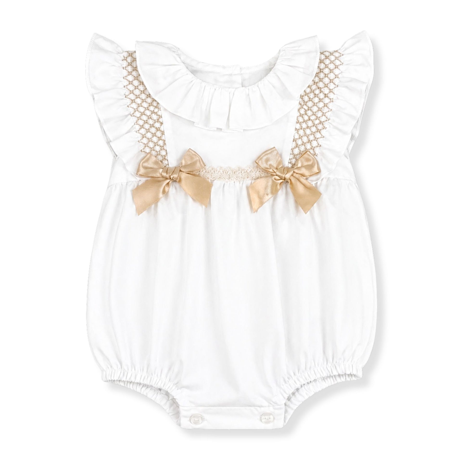 White baby romper with gold bow details on a white background