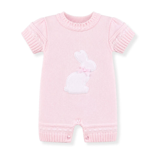 Pink baby romper with bunny design by dandelion on a white background
