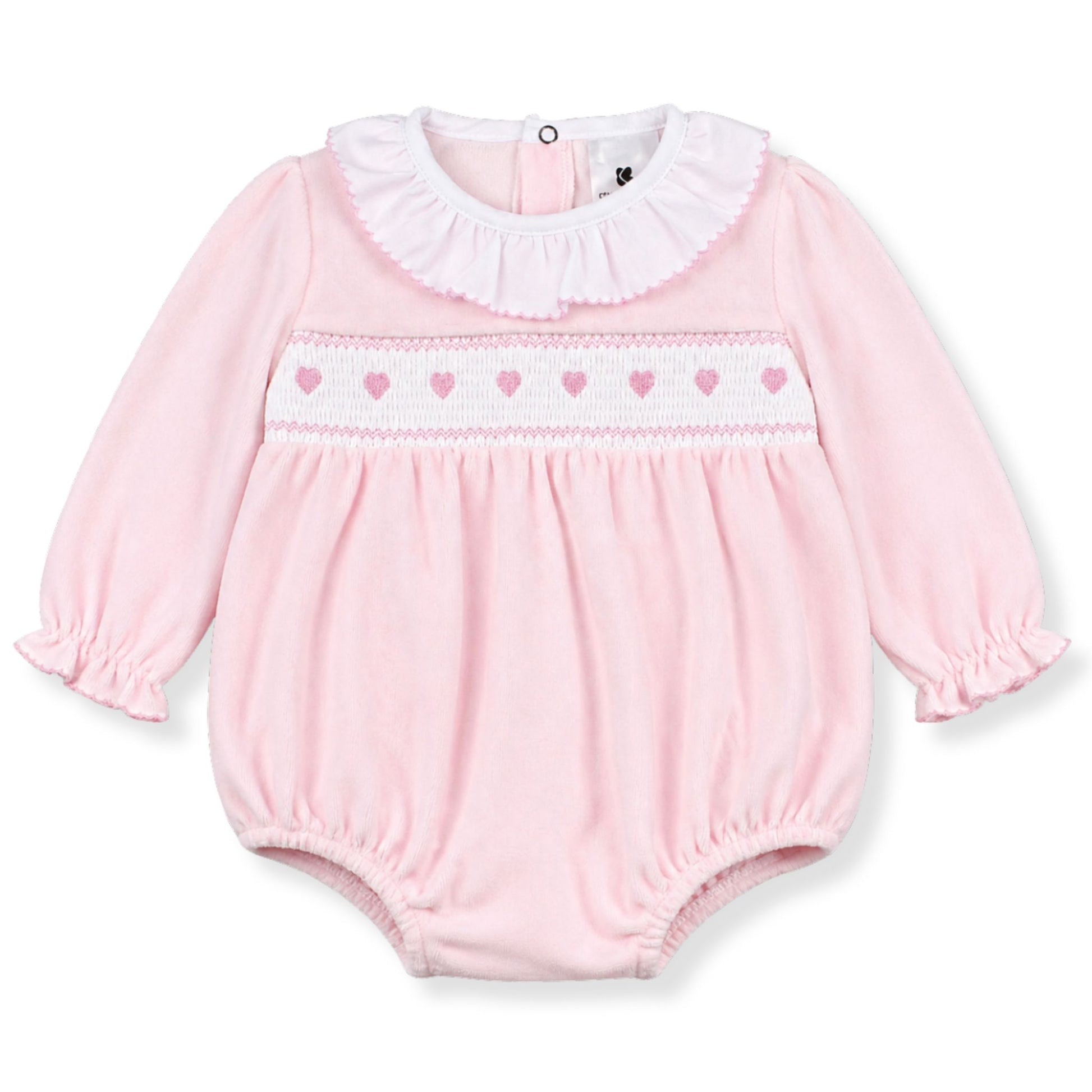 Pink baby romper with heart patterns on a white background