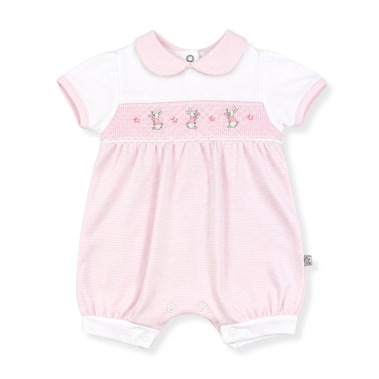 Pink baby romper with white trim  and embroidered bunnies by Dandelion Babywear on a white background
