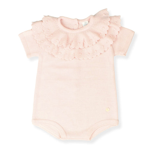 Pink babyromper with ruffled sleeves on a white background