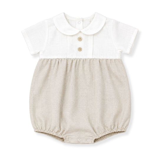 Baby romper with white top and beige bottom on a white background