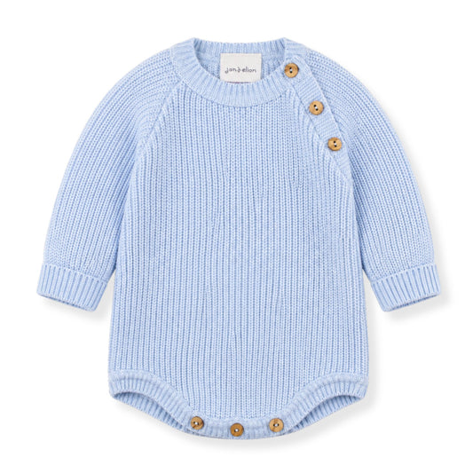 Light blue baby romper with brown buttons on a white background