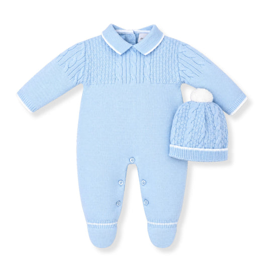 Light blue baby knitted outfit with matching hat on a white background