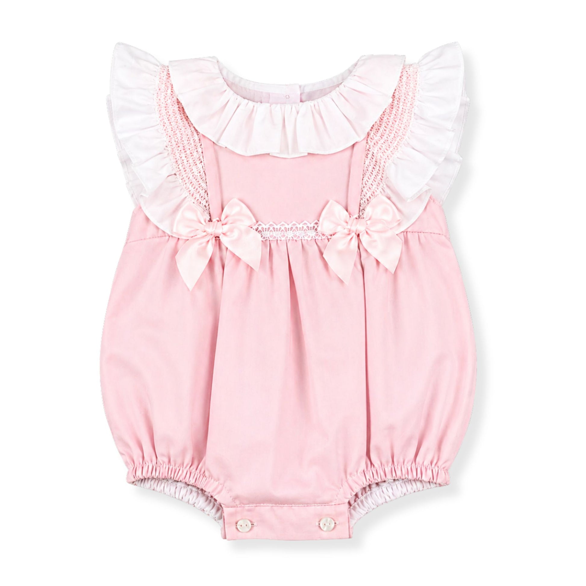 Pink baby romper with ruffled collar and bow details  in a spanish style on a white background