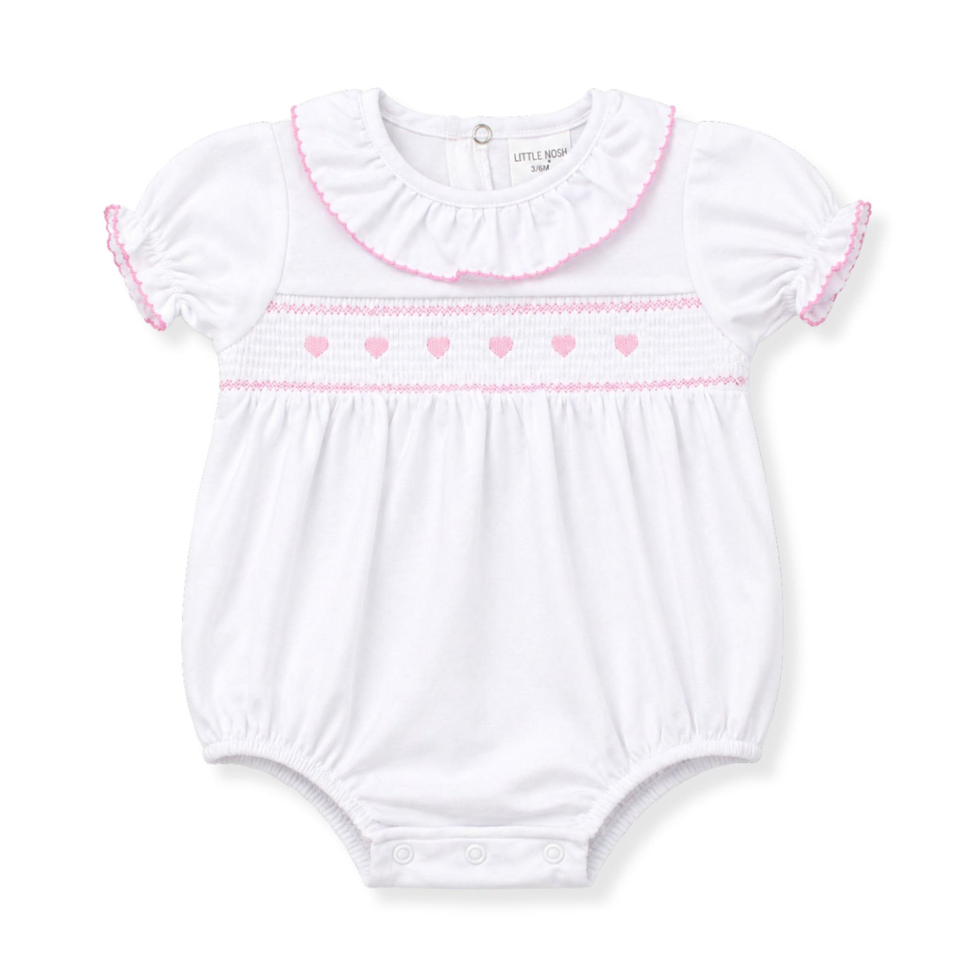 White baby romper with pink trim on a white background